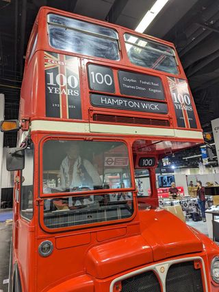 A bus celebrating Celestion's 100th anniversary on the floor of the 2024 NAMM show