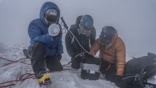 Three members of the expedition take samples on the flanks of Mount Michael.