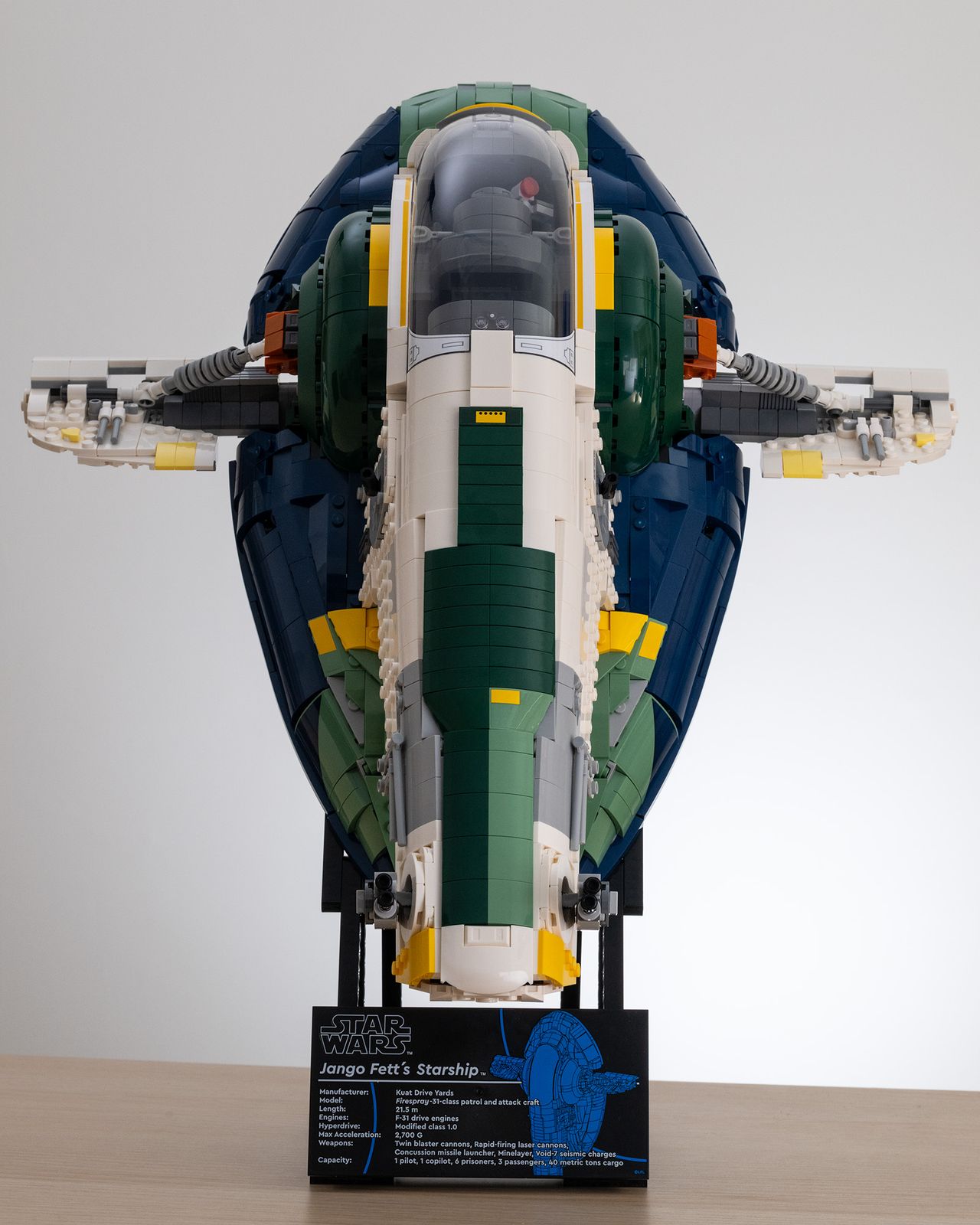 Lego Star Wars UCS Jango Fett&rsquo;s Firespray-Class Starship (75409) on a table with a white background front image