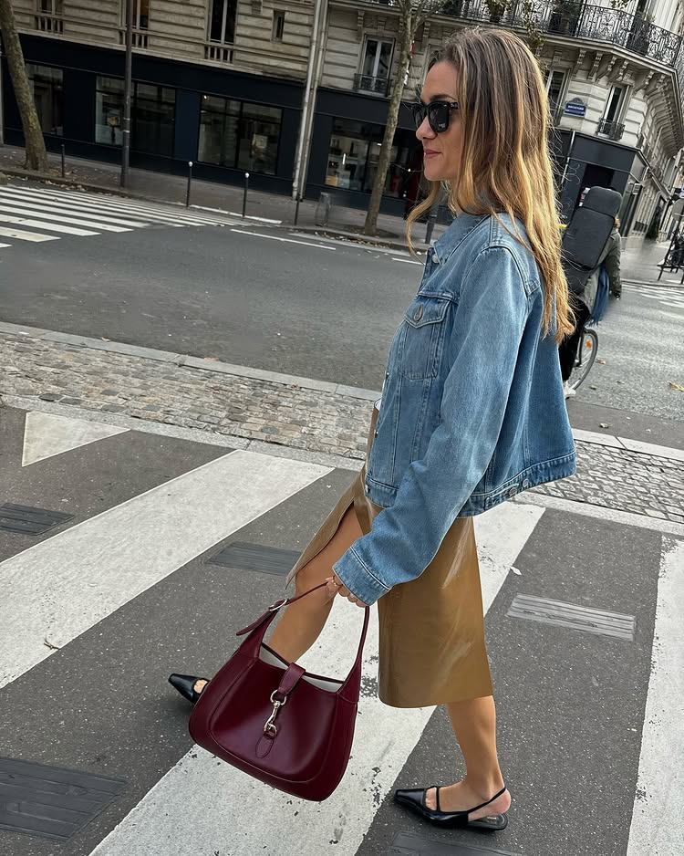 @anneluremais wore a denim jacket with a tan skirt and black slingback sandals