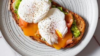 Two poached eggs with avocado on toast