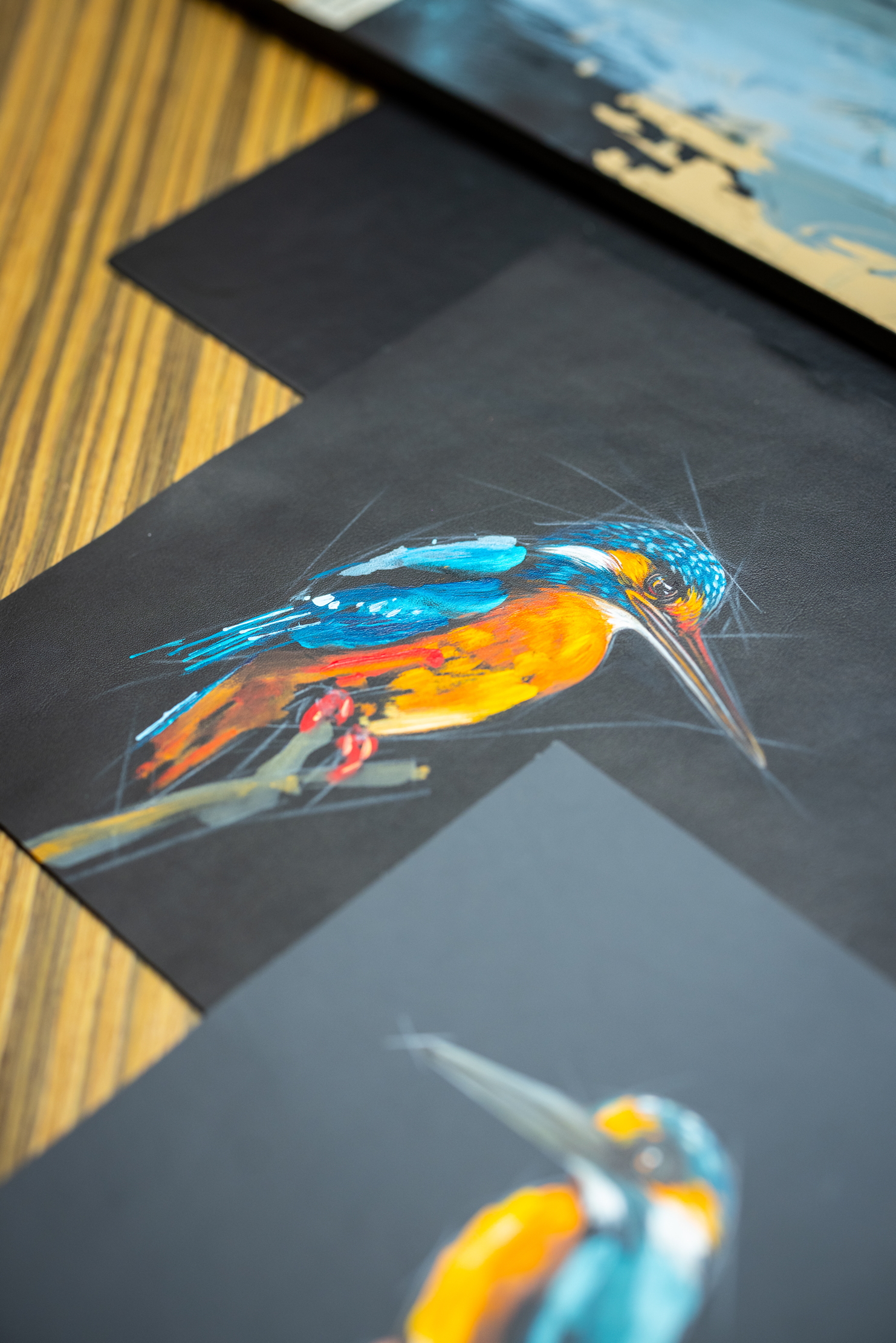 Images of Rolls Royce craftspersons creating a triptych of nature scenes featuring a kingfisher