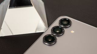 The redesigned camera lens covers around the raised lenses on the back of the Samsung Galaxy S25