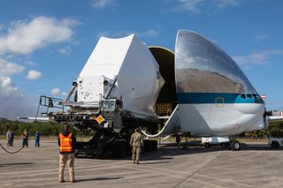 NASA's Orion spacecraft is loaded inside the belly of the Super Guppy aircraft at the Launch and Landing Facility runway at Kennedy Space Center in Florida, on Nov. 21. The spacecraft, which will fly on the first Artemis mission, was transported to NASA's Plum Brook Station in Sandusky, Ohio, for testing.