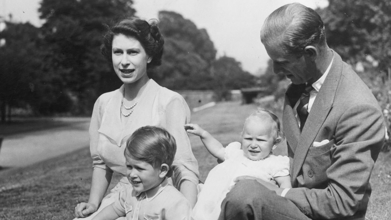 The Queen&#039;s parenting style seen here as she sits with Prince Philip, Duke of Edinburgh and Prince Charles and Princess Anne in the grounds of Clarence House