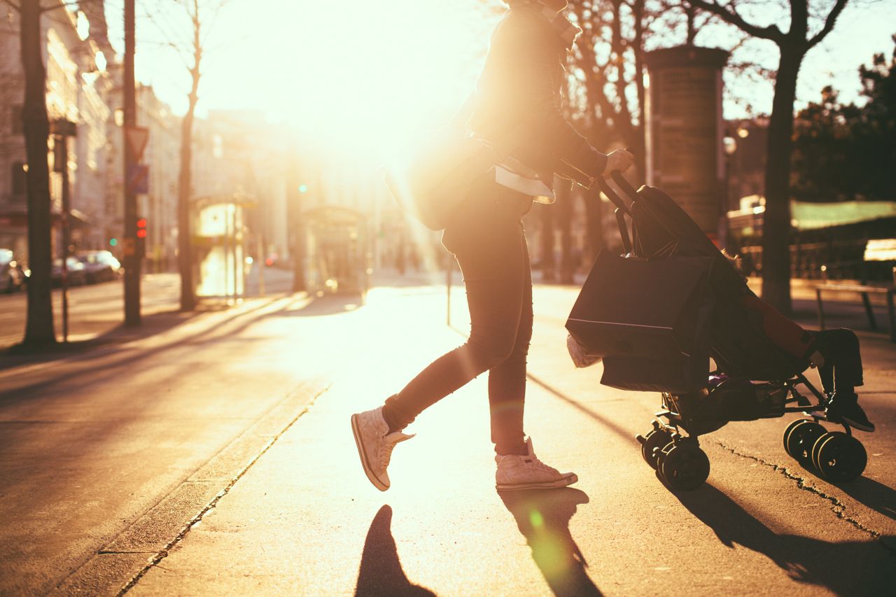 Pushing a stroller.