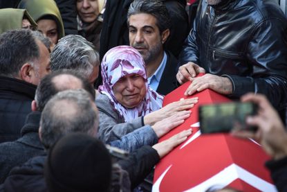Mourners grieve following a New Year's attack in Istanbul 