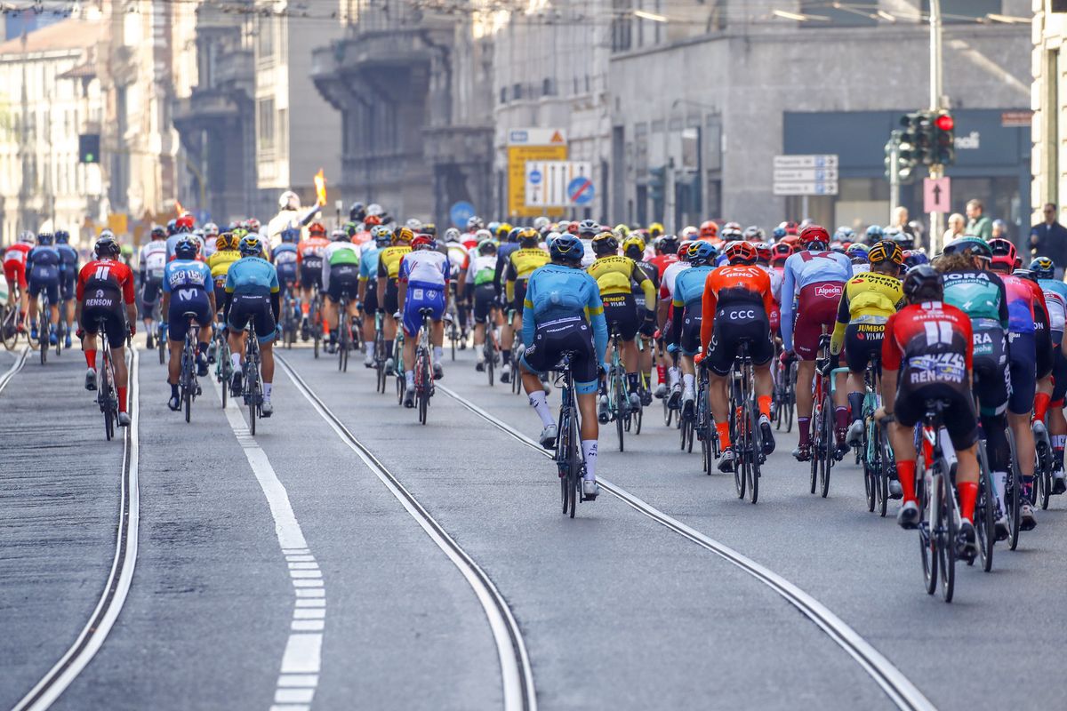 The riders head out of Milan