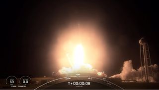 A SpaceX Falcon 9 rocket launches 60 Starlink internet satellites into orbit from NASA's Kennedy Space Center in Cape Canaveral, Florida as it makes a record 9th trip to space on March 14, 2021.