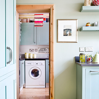 laundry room with blue cupboard