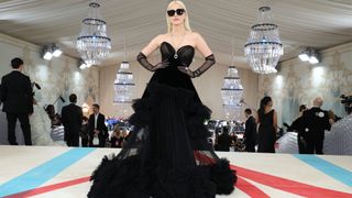 Jessica Chastain on the 2023 Met Gala red carpet in a black gown with blonde hair