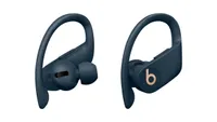 The beats powerbeats pro true wireless earbuds with a gold beats logo