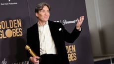 Cillian Murphy poses with Golden Globe for "Oppenheimer"