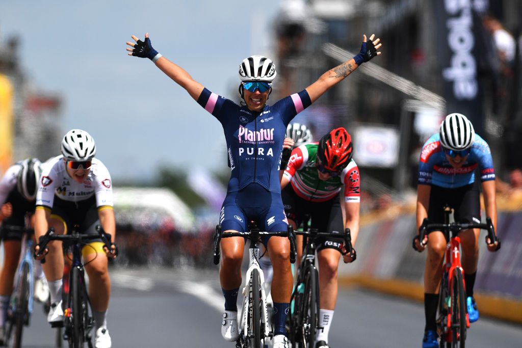 MIDDELKERKE BELGIUM JUNE 26 Kim De Baat of Belgium and Team PlanturPura celebrates at finish line as race winner ahead of Sara Maes of Belgium and Multum Accountants Ladies Cycling Team and Julie Hendrickx of Belgium and Team Bingoal Casino Chevalmeire Van Eyck Sport during the 123rd Belgian Road Championship 2022 Womens Road Race a 1199km one day race from Middelkerke to Middelkerke BKMiddelkerke on June 26 2022 in Middelkerke Belgium Photo by Luc ClaessenGetty Images