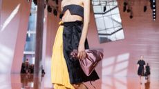 Prada S/S 2026 womenswear show featuring drawstring pouch summer accessory