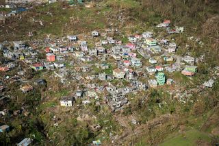 An aerial view of Roseau, the capital of the Caribbean island of Dominica, reveals destruction wrought by Hurricane Maria that passed over Sept. 18 as a Category 4 storm.