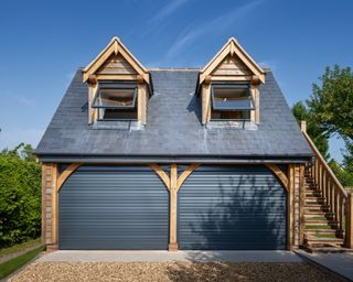 Double garage with pitched roof and side staircase