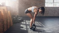 Woman burning fat and building muscle during a workout