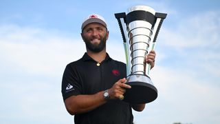 Jon Rahm with the Individual Championship trophy