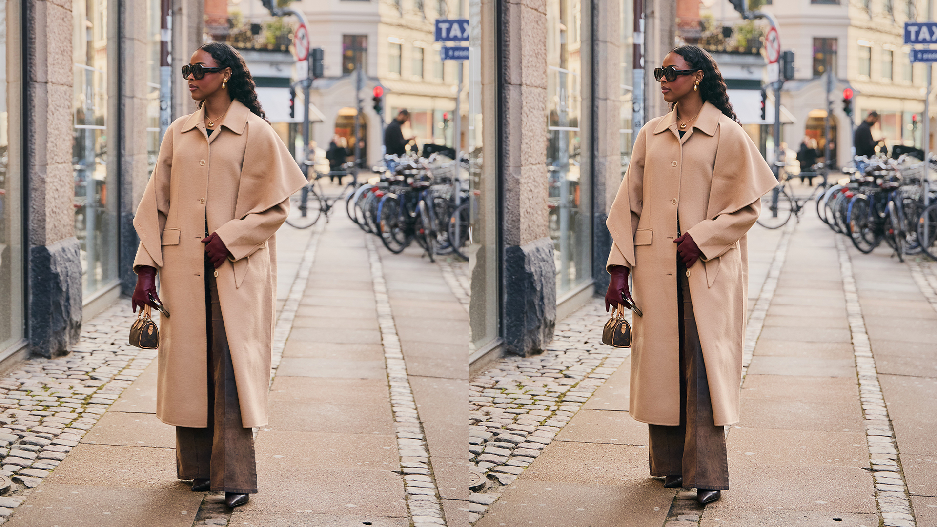 Woman wears trench coat and trousers while posing with a small Louis Vuitton handbag. 