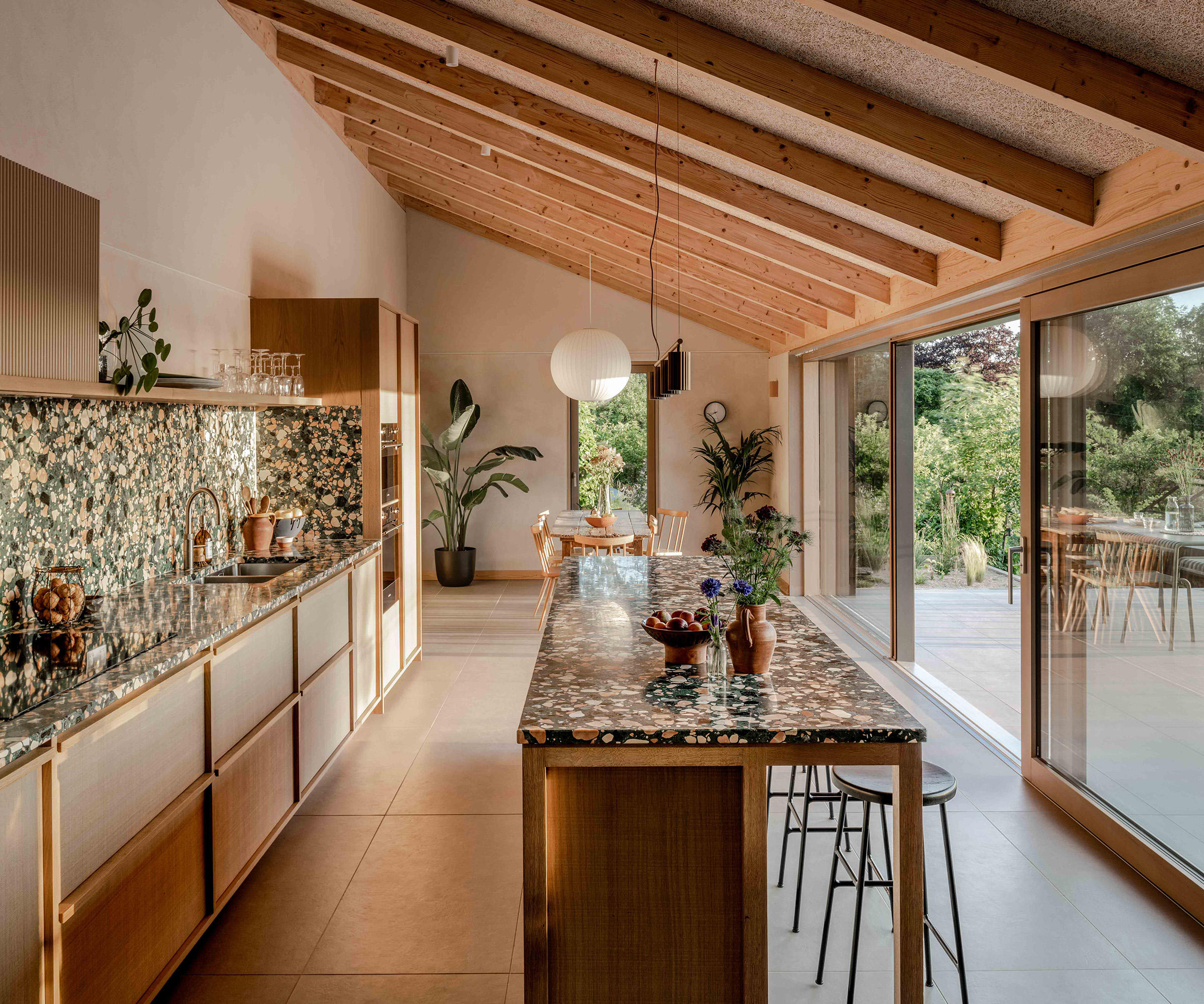 Newly renovated kitchen with sloping roof and exposed timber
