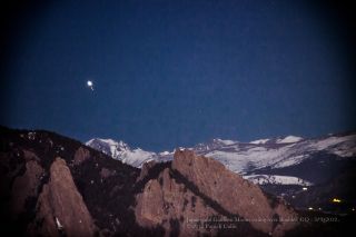Jupiter and moons over Colorado mountains