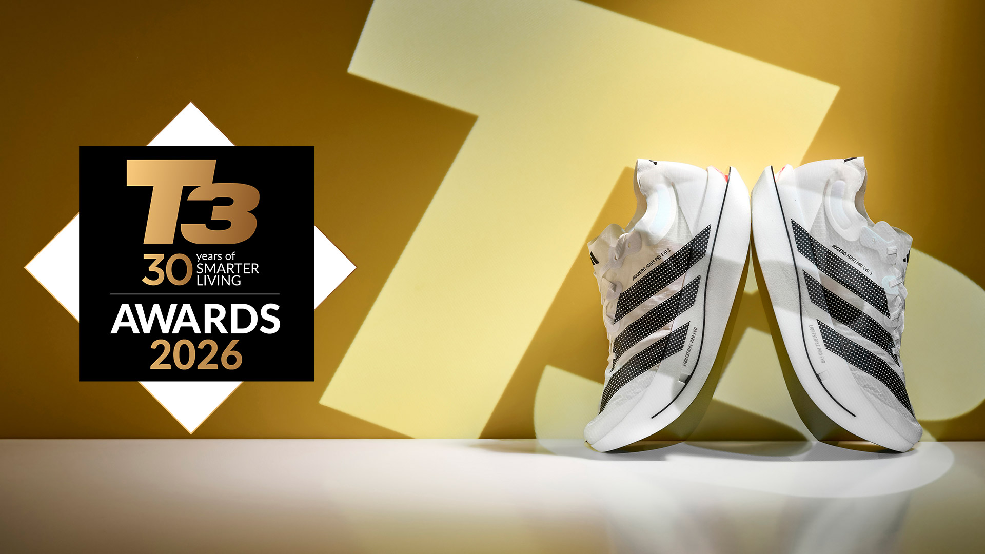 Adidas Adizero on a white surface in front of a yellow T3 logo, and next to a T3 30th Anniversary Awards 2026 logo