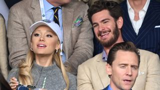Ariana Grande, Andrew Garfield and Tom Hiddleston watch Carlos Alcaraz vs Novak Djokovic in the Wimbledon 2023 men's final on Centre Court during day fourteen of the Wimbledon Tennis Championships at the All England Lawn Tennis and Croquet Club on July 16, 2023 in London, England.