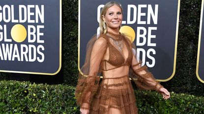 Gwyneth Paltrow wears a revealing dress on the red carpet.