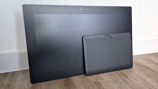 A photo of the Xencelabs Pen Display 24 and Xencelabs Medium tablet against a wall