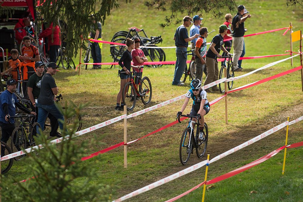 Emma Swartz (USA) Trek Cyclo-cross Collective makes her way past the pit area during the final 2 laps of racing.