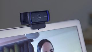 Logitech C920 webcam on top of a laptop.