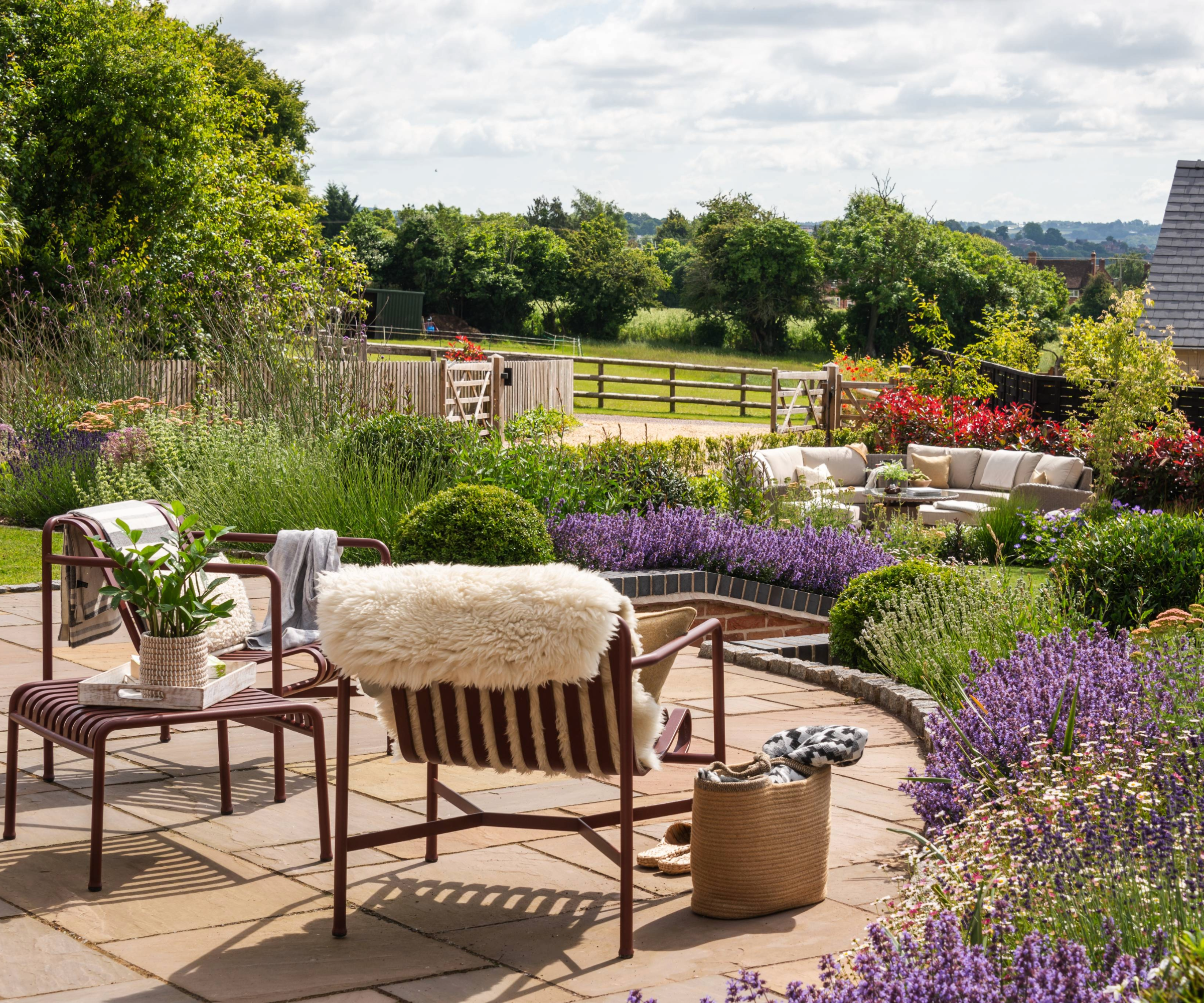 Garden with patio, chairs and flowerbeds
