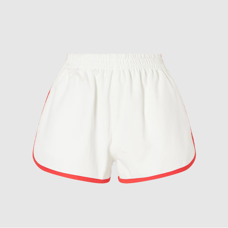 White track shorts with red piping.