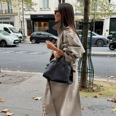 The Paris outfit featuring stylish jeans, a trench coat, and a blazer