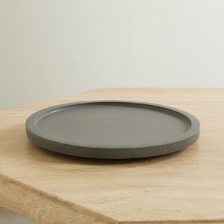 louise roe round tray on a wood background