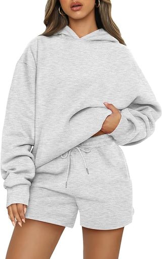 Model wears gray sweatsuit 