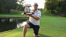 Ben Campbell holds the Hong Kong Open trophy in 2023