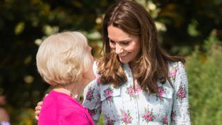 Kate Middleton and Mary Berry smile and each other, with on arm around each other as they attend the attend the "Back to Nature" festival at RHS Garden Wisley on September 10, 2019 in Woking, England.