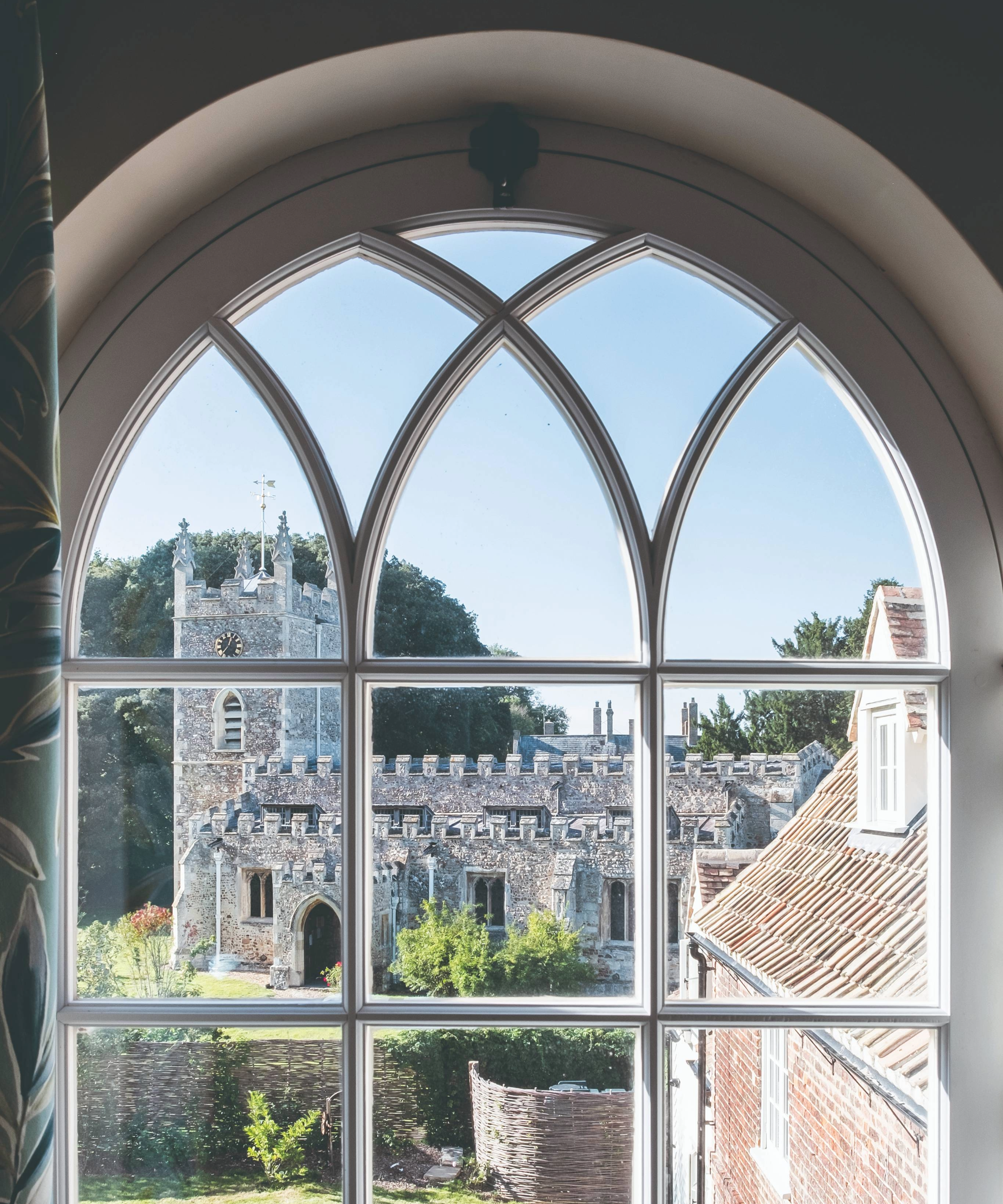 Church tower through arched window