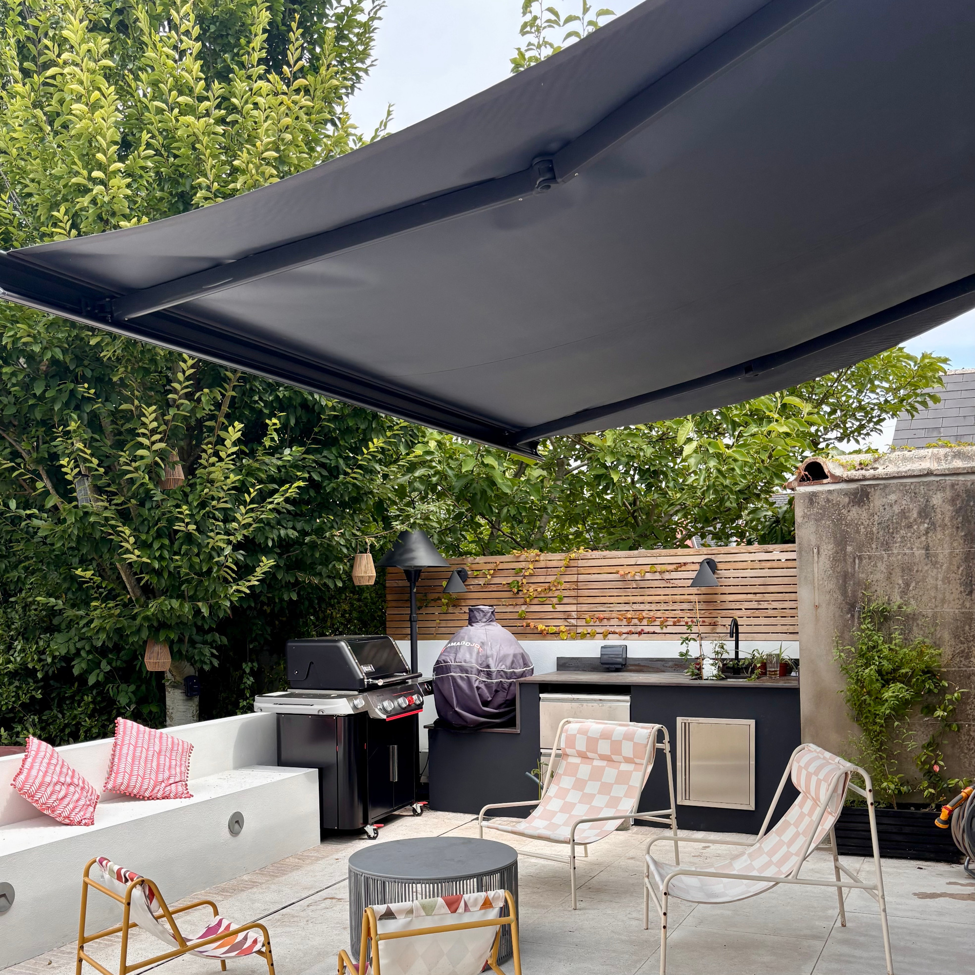 open crank awning on a patio with seating