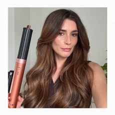 Eleanor holding the Dyson Airwrap Coandax2 with the curling barrel