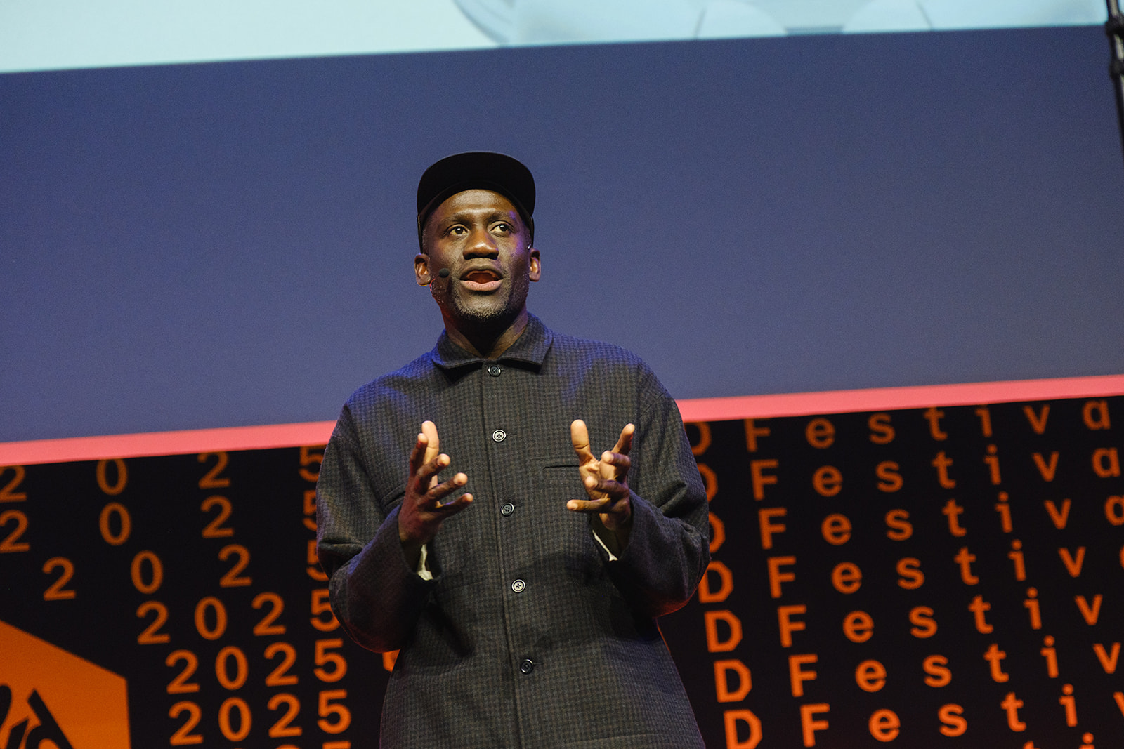 picture of Kwame Taylor-Hayford - man in a baseball cap and black shirt