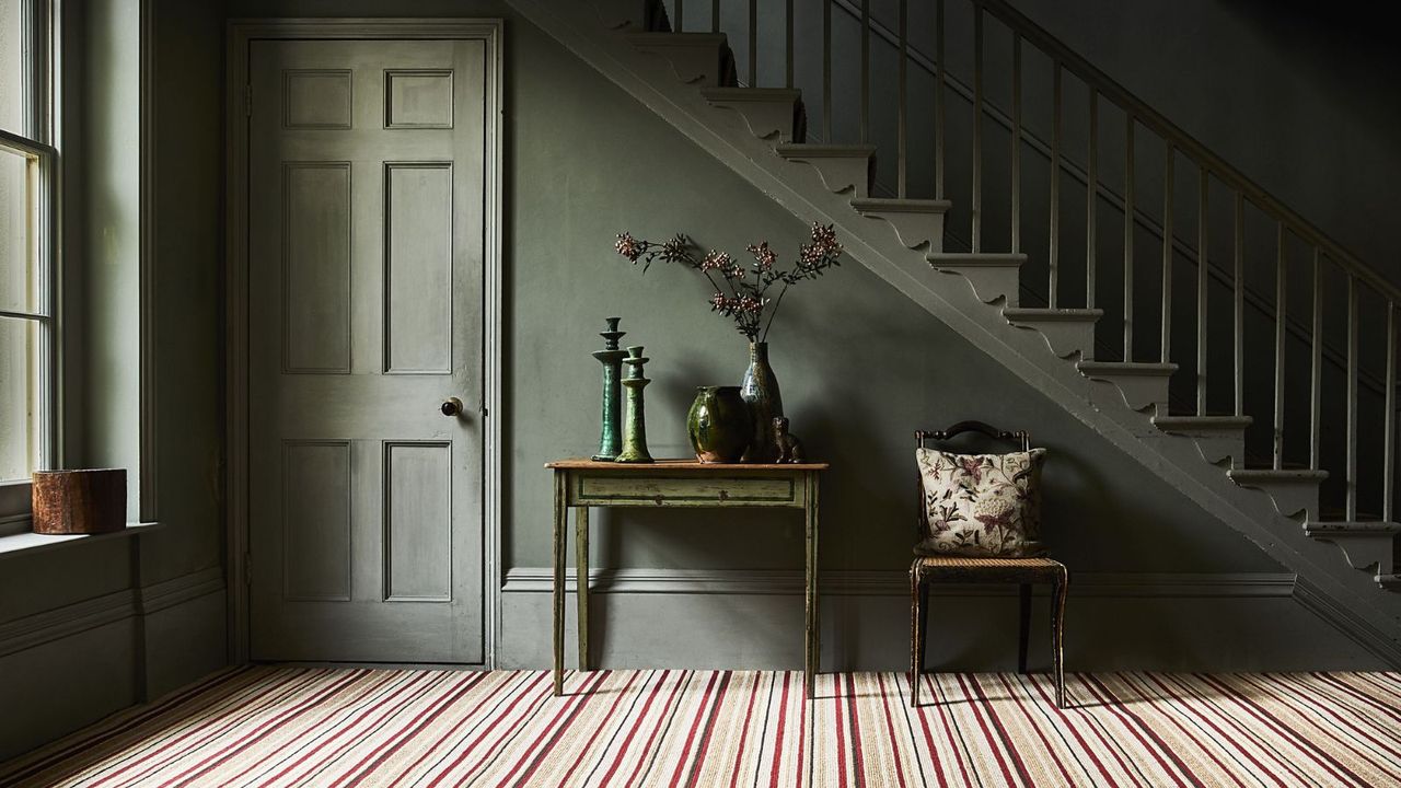 Striped carpet, green staircase