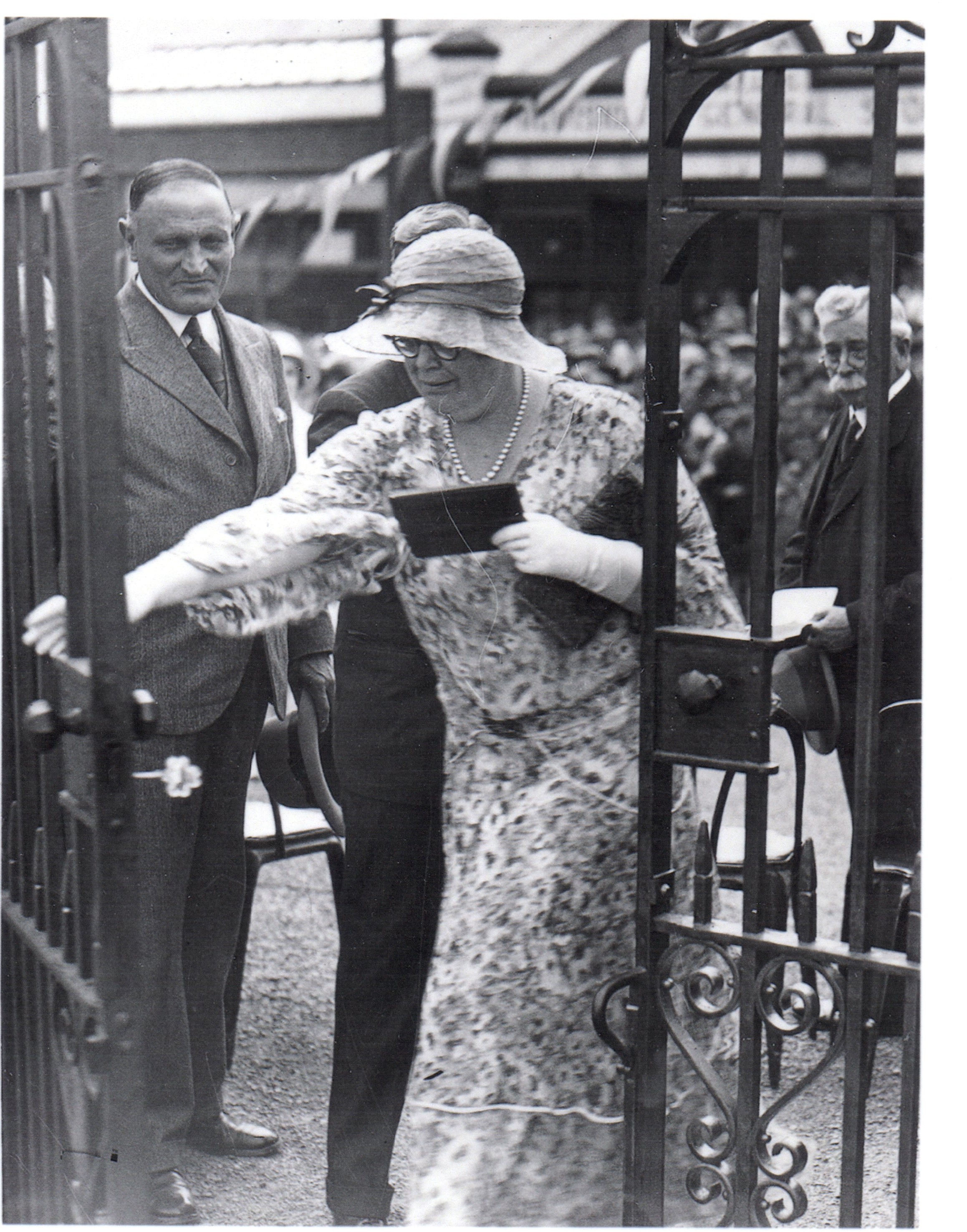 Eileen Elgar, officially opening gates in Larne Park in August 1933