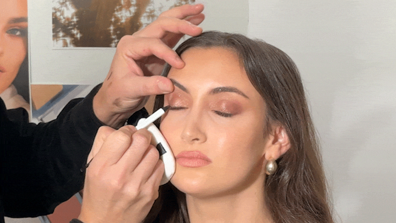 A gif of Alyssa Brascia getting her makeup done by Mario Dedivanovic.