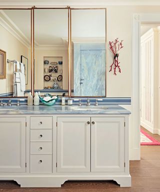 Twin sinks, blue shower and countertop