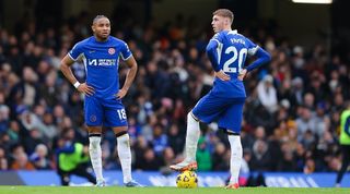 Christopher Nkunku and Cole Palmer of Chelsea look dejected after conceding during the Premier League match between Chelsea and Wolverhampton Wanderers at Stamford Bridge in February 2024.