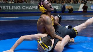 Jharrel Jerome as Anthony Robles holds his wrestling opponent down