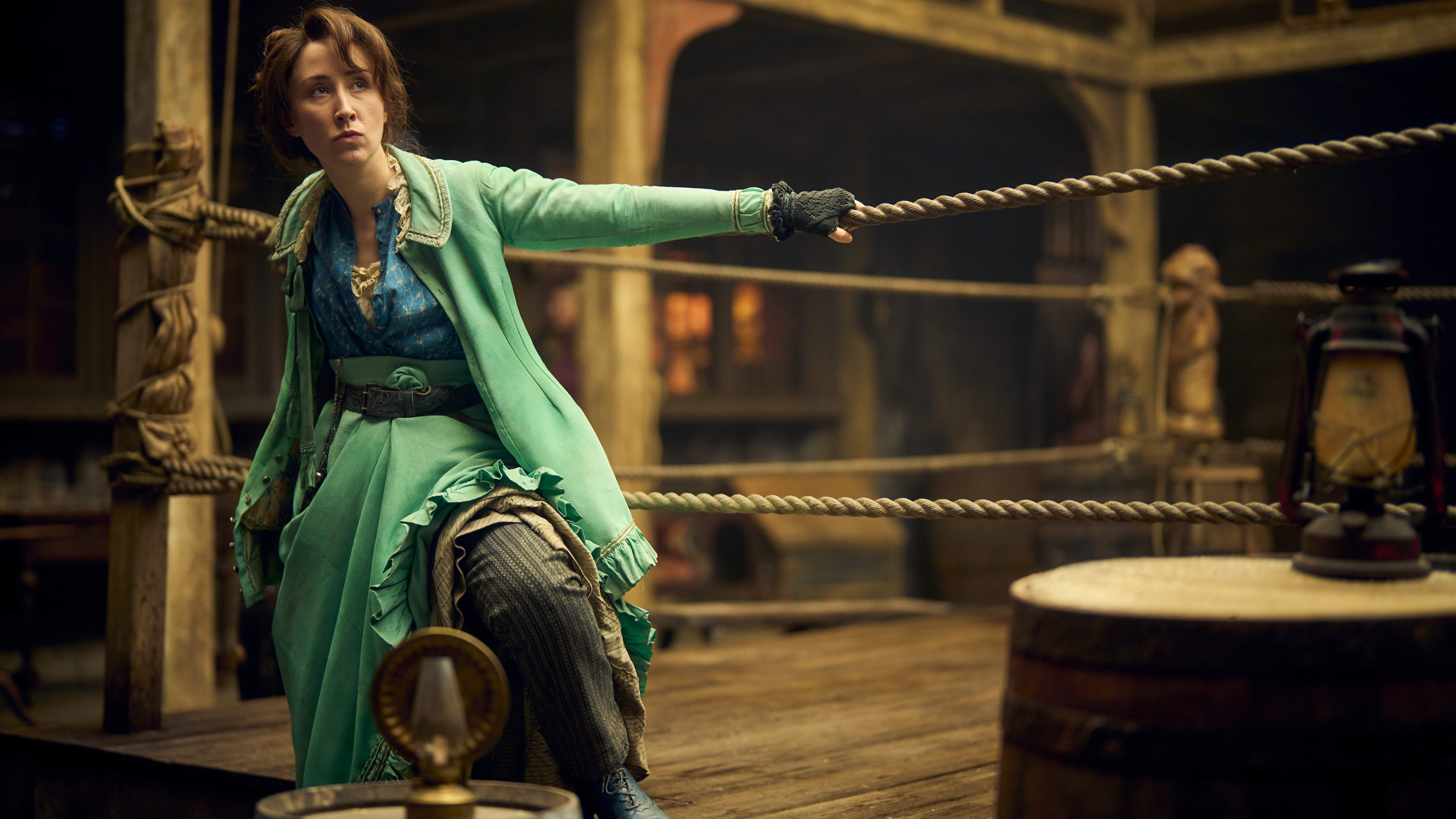 Mary Carr (Erin Doherty) sitting on the ropes of a boxing ring in a scene from "A Thousand Blows"